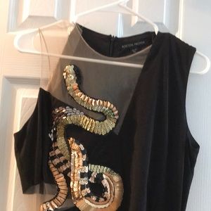 Beautiful snake detail gown with slit.